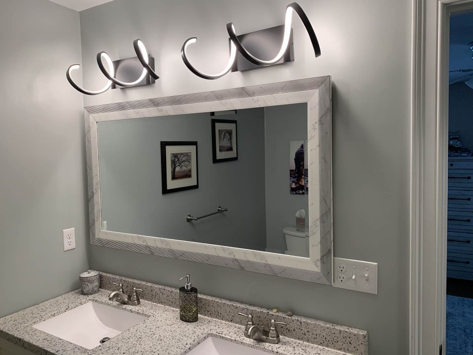 A modern light fixture installed in a Boston bathroom